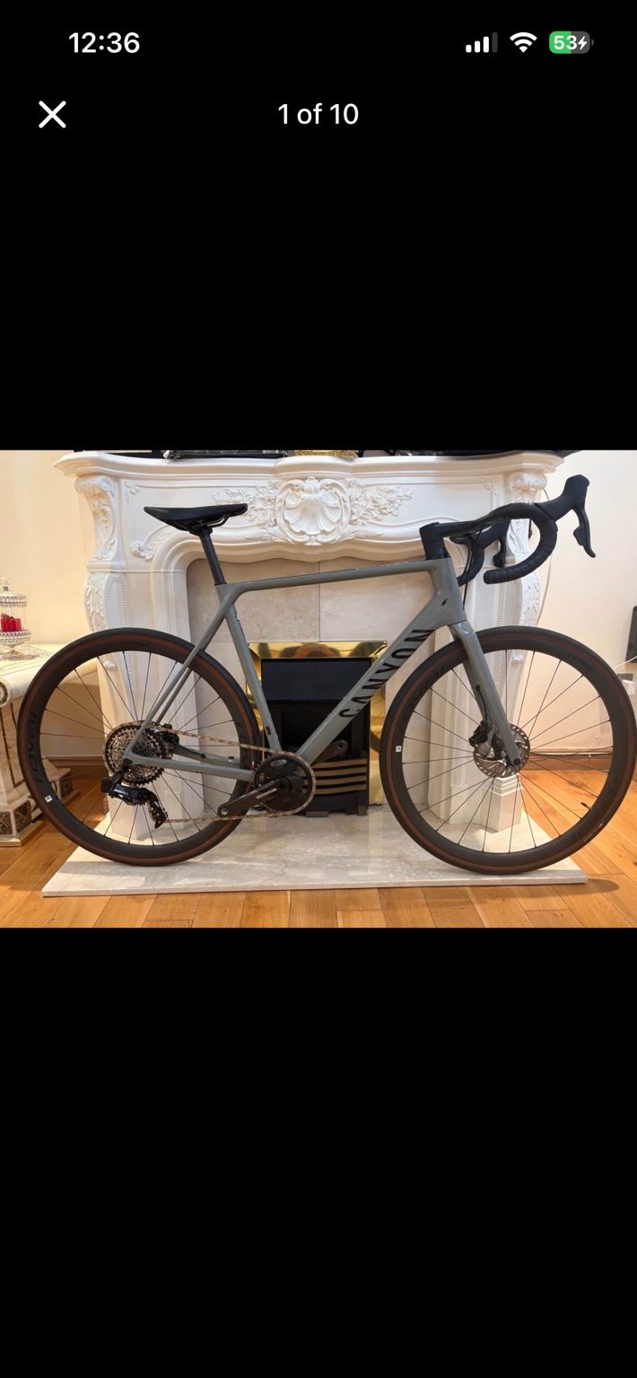 Grey Canyon Ultimate CF SL 8.0 road bike with Roval carbon wheels, drive-side view