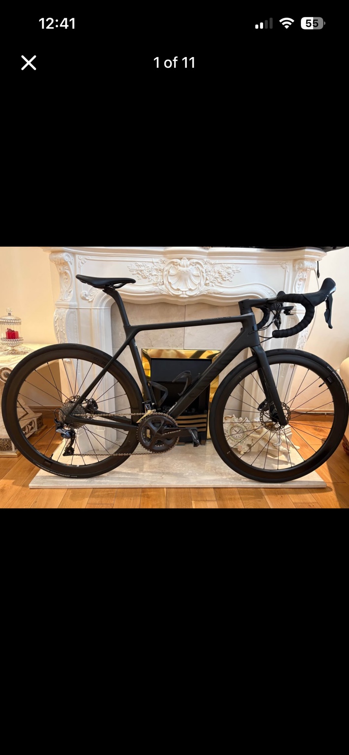 Black Canyon Ultimate CF SL 9.0 road bike with carbon wheels, drive-side view